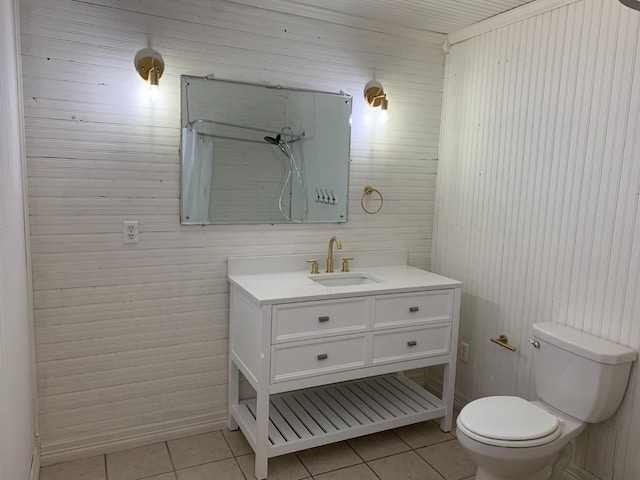 bathroom with vanity, toilet, and tile patterned flooring