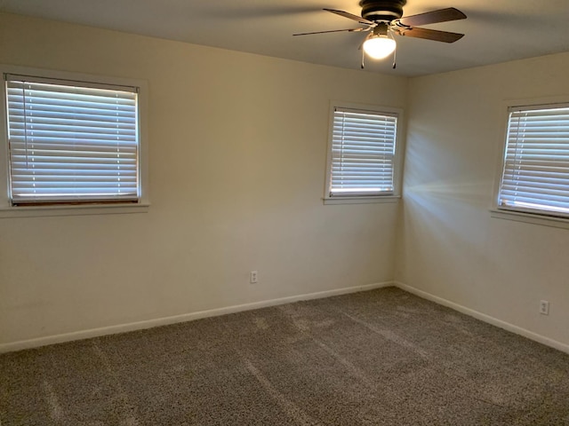 spare room with carpet floors and ceiling fan