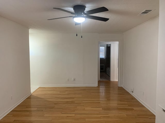 spare room with ceiling fan and light hardwood / wood-style flooring