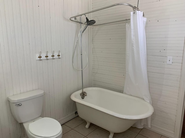 bathroom featuring tile patterned flooring and toilet