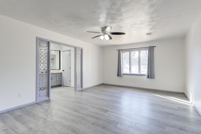 unfurnished room featuring ceiling fan and light hardwood / wood-style floors