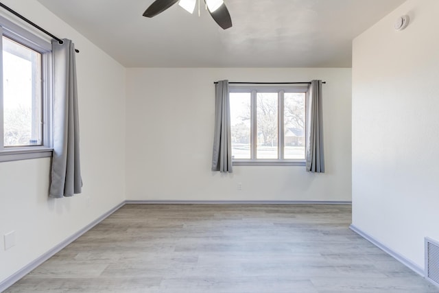 unfurnished room with ceiling fan and light hardwood / wood-style flooring