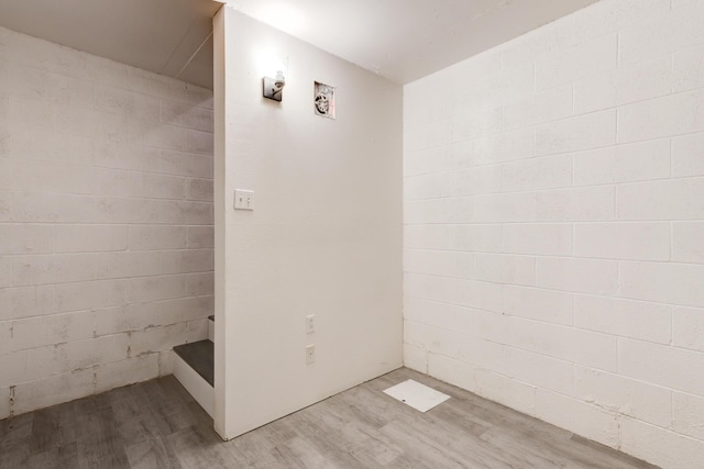 bathroom with hardwood / wood-style flooring