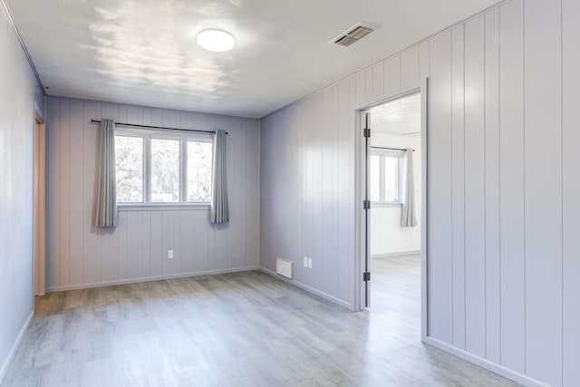 unfurnished room featuring light hardwood / wood-style flooring