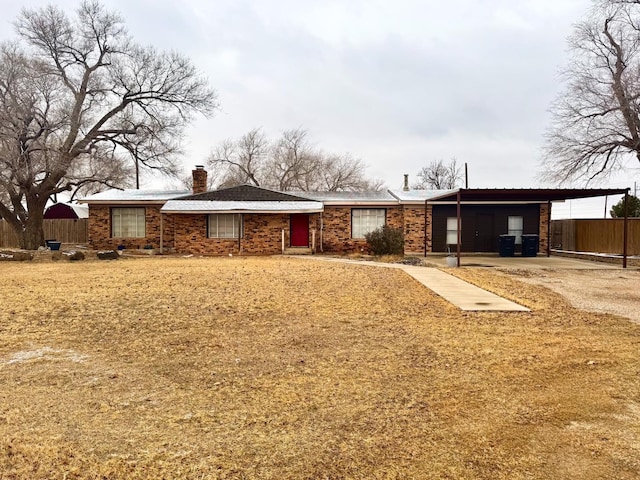 ranch-style home with a carport