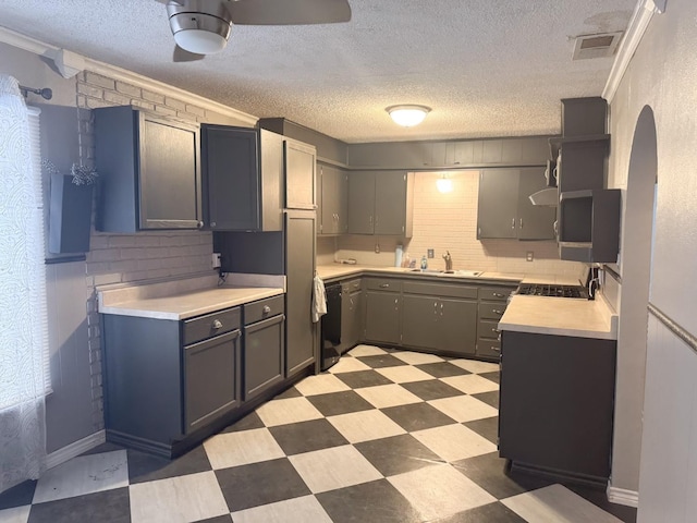 kitchen featuring sink, gray cabinets, black dishwasher, tasteful backsplash, and ornamental molding