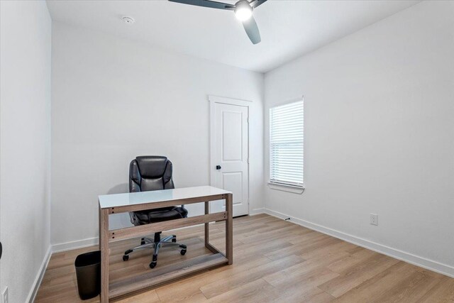 office with ceiling fan and light wood-type flooring