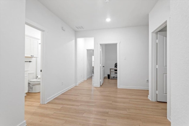 hall with light wood-type flooring