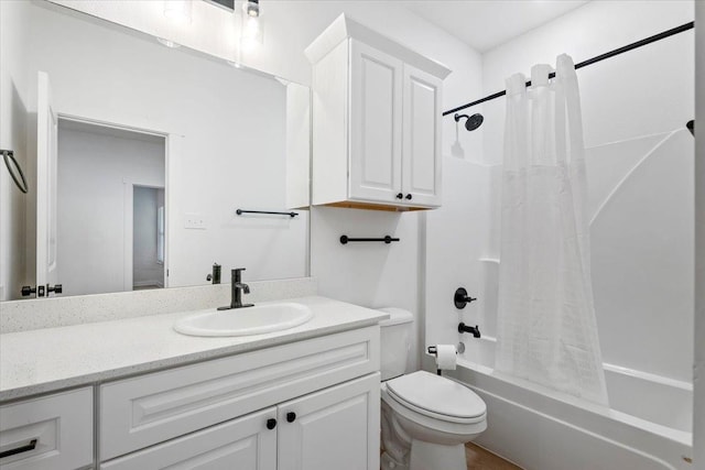 full bathroom featuring shower / bath combo, vanity, and toilet