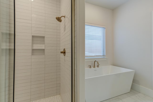 4603 140th St, Lubbock, TX 79424 - bathroom featuring a freestanding tub, a shower stall, and marble finish floors