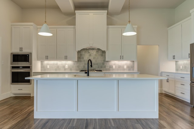 4603 140th St, Lubbock, TX 79424 - kitchen with stainless steel appliances, light countertops, a kitchen island with sink, and white cabinets