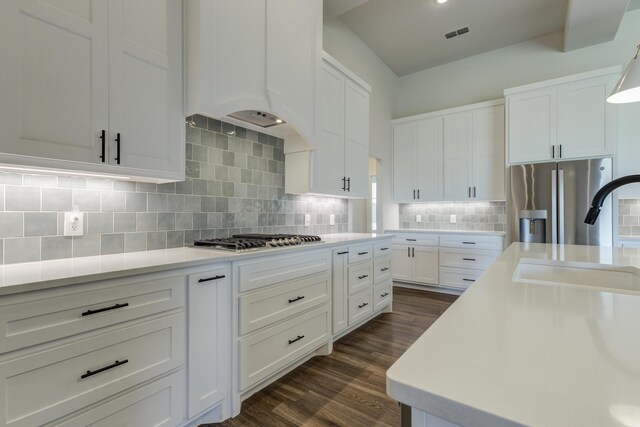 4603 140th St, Lubbock, TX 79424 - kitchen with stainless steel appliances, light countertops, dark wood-style floors, and white cabinetry