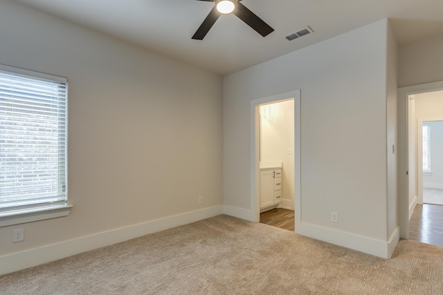 4603 140th St, Lubbock, TX 79424 - unfurnished bedroom with carpet, multiple windows, ensuite bath, and ceiling fan