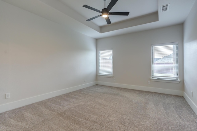 4603 140th St, Lubbock, TX 79424 - spare room featuring plenty of natural light, light carpet, a tray ceiling, and ceiling fan