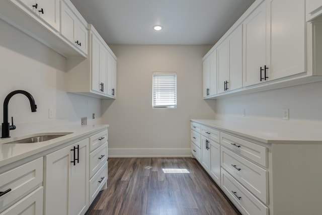4603 140th St, Lubbock, TX 79424 - laundry area with cabinet space, dark wood-style flooring, recessed lighting, and hookup for a washing machine