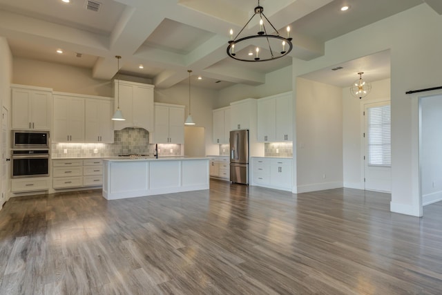 4603 140th St, Lubbock, TX 79424 - kitchen with appliances with stainless steel finishes, a chandelier, tasteful backsplash, white cabinets, and beamed ceiling