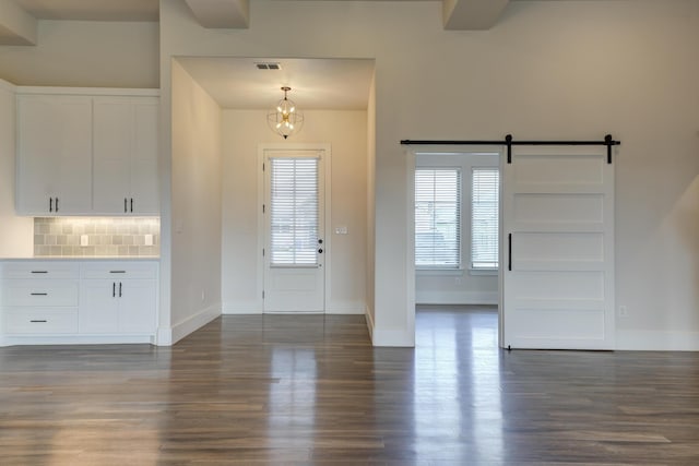 4603 140th St, Lubbock, TX 79424 - entryway with dark wood-style floors and a barn door