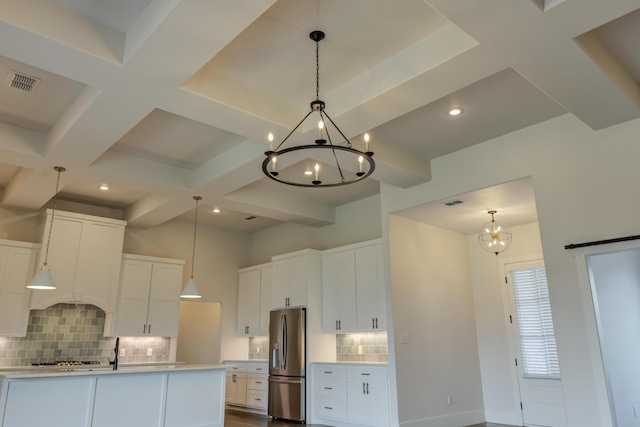 4603 140th St, Lubbock, TX 79424 - kitchen featuring stainless steel refrigerator with ice dispenser, a chandelier, backsplash, white cabinets, and coffered ceiling