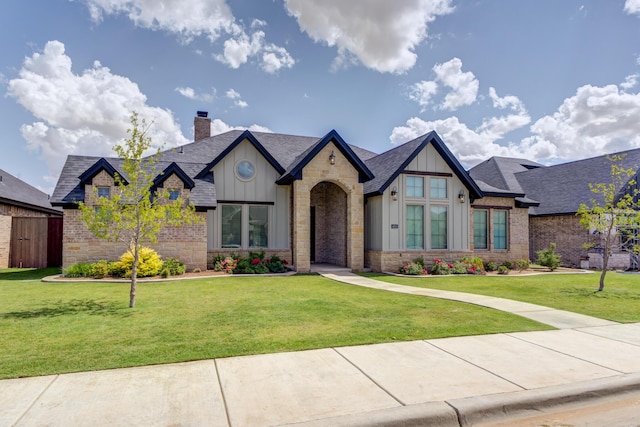 4603 140th St, Lubbock, TX 79424 - view of front facade featuring board and batten siding, a chimney, a front yard, and roof with shingles