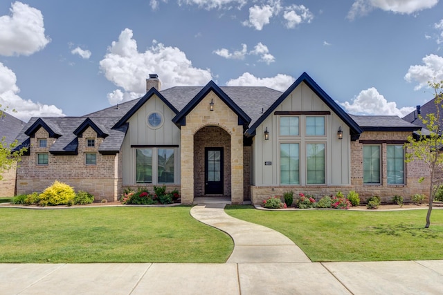 4603 140th St, Lubbock, TX 79424 - view of front facade with board and batten siding, a front yard, and roof with shingles