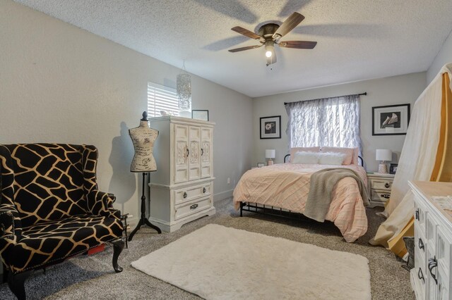 carpeted bedroom with ceiling fan, vaulted ceiling, and a textured ceiling