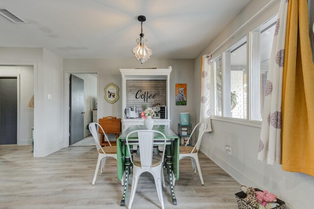 dining space featuring light wood-type flooring