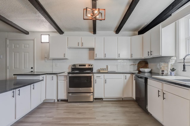 kitchen with dishwasher, dark countertops, stainless steel electric range oven, white cabinetry, and a sink