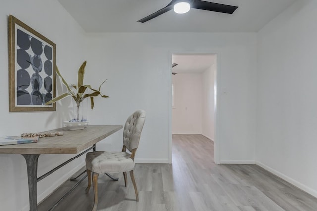 office with ceiling fan, light wood-style flooring, and baseboards