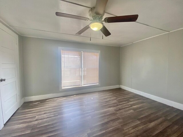 unfurnished room featuring dark hardwood / wood-style floors and ceiling fan