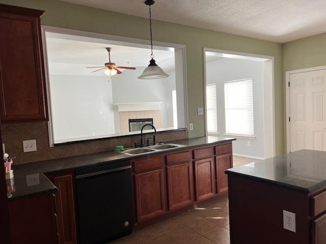 kitchen with dishwasher, sink, backsplash, dark tile patterned flooring, and ceiling fan