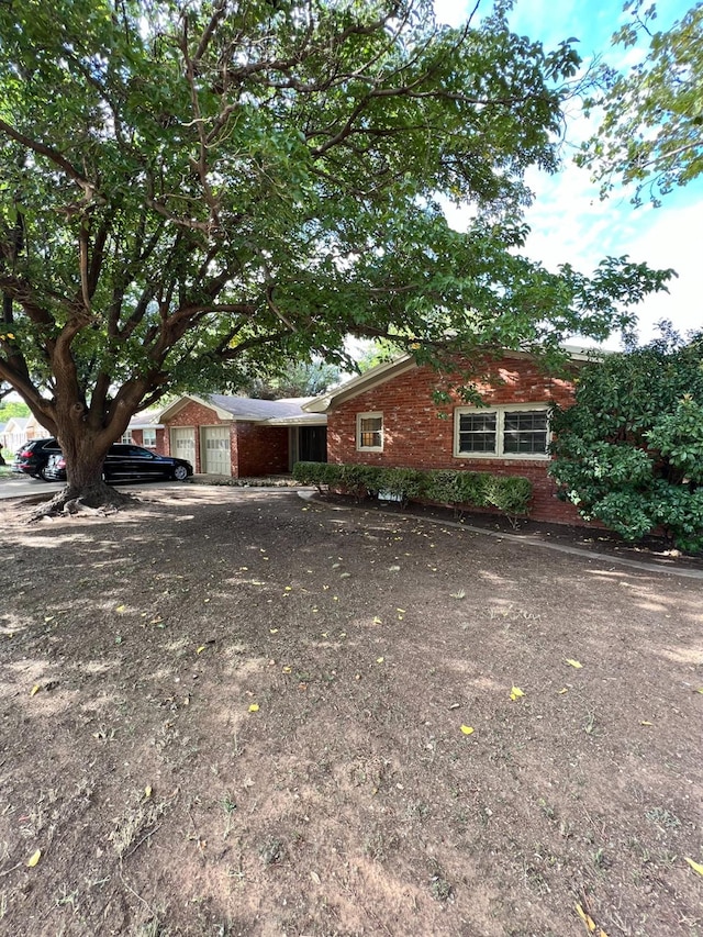 view of side of property with a garage