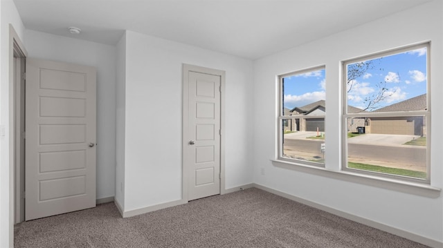 unfurnished bedroom featuring carpet