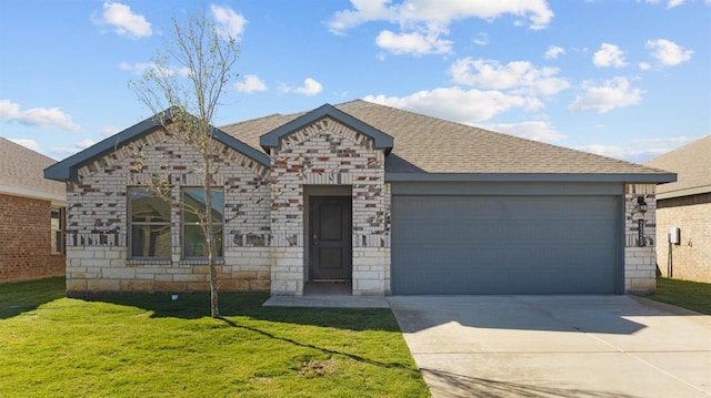 view of front of property with a garage and a front yard