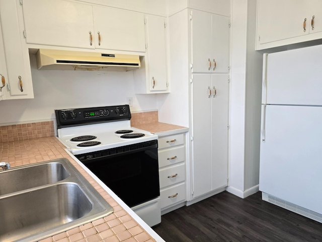 kitchen featuring sink, electric range, dark hardwood / wood-style floors, white cabinets, and white fridge