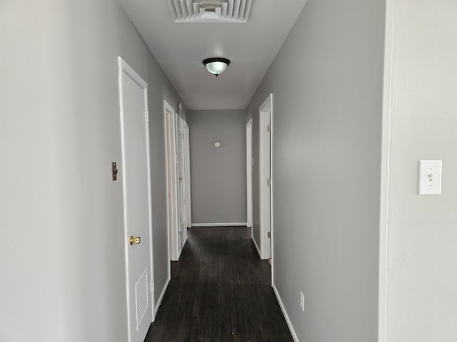 hall featuring dark wood-type flooring