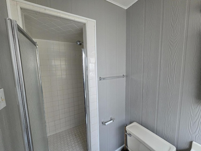 bathroom with an enclosed shower and toilet