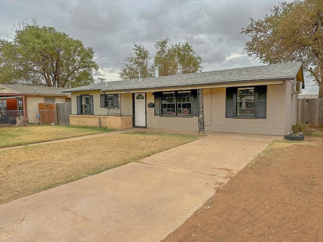 ranch-style house featuring a front lawn