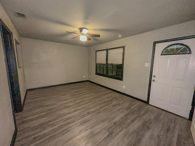 entrance foyer featuring wood-type flooring, ceiling fan, and a textured ceiling