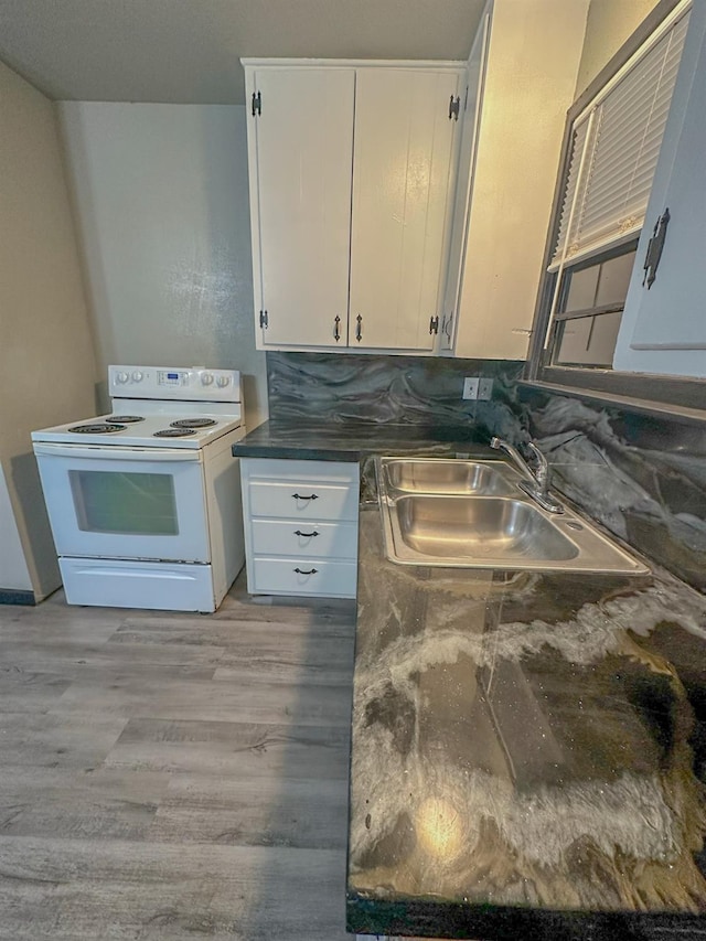 kitchen with sink, light wood-type flooring, white cabinets, and white electric range oven