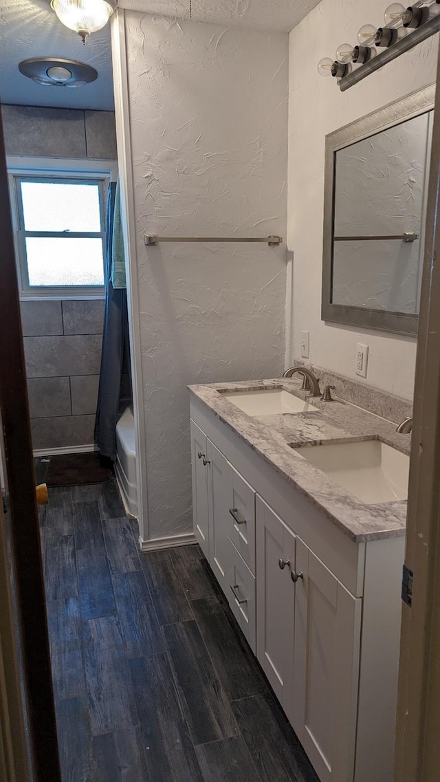 bathroom with vanity and hardwood / wood-style flooring