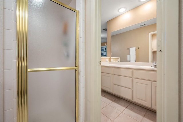 314 York Ave, Lubbock, TX 79416 - bathroom featuring vanity, tile patterned floors, and a shower stall