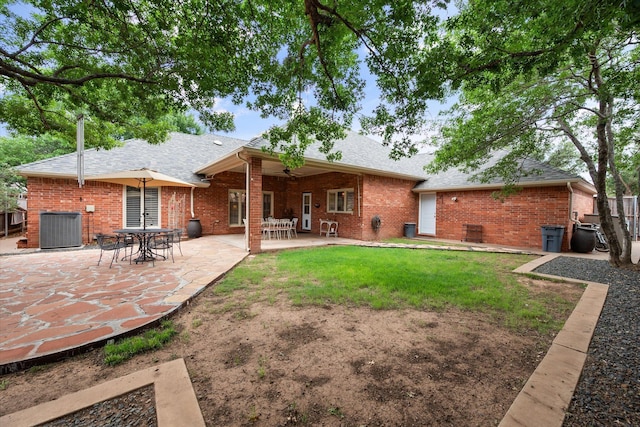 314 York Ave, Lubbock, TX 79416 - back of property with brick siding, a patio area, and a shingled roof