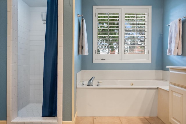 314 York Ave, Lubbock, TX 79416 - full bath with a shower stall, a bath, and tile patterned floors