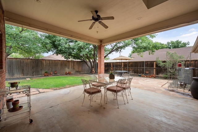 314 York Ave, Lubbock, TX 79416 - fenced backyard featuring outdoor dining space, ceiling fan, and a patio