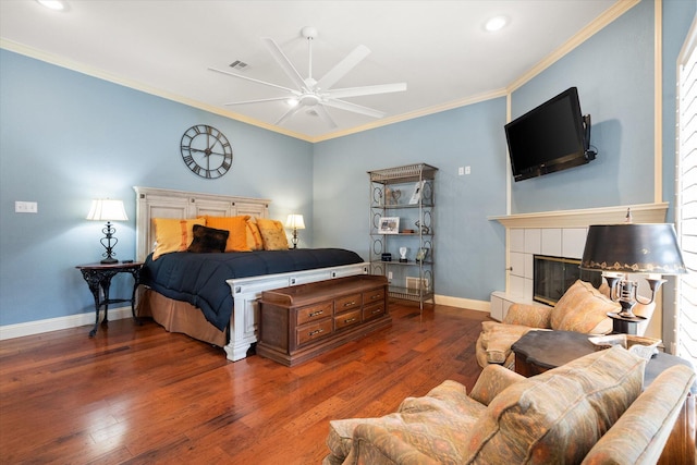 314 York Ave, Lubbock, TX 79416 - bedroom featuring wood finished floors, ornamental molding, a tiled fireplace, recessed lighting, and a ceiling fan