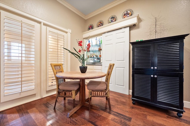 314 York Ave, Lubbock, TX 79416 - dining area featuring crown molding, dark wood-type flooring, and a textured wall