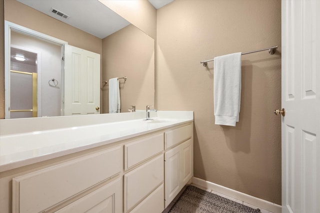 314 York Ave, Lubbock, TX 79416 - full bath featuring vanity, tile patterned flooring, and a shower with door