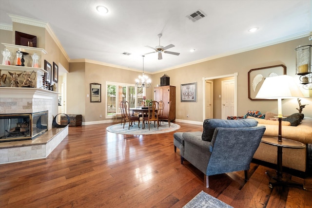 314 York Ave, Lubbock, TX 79416 - living area featuring ceiling fan, a chandelier, wood finished floors, a multi sided fireplace, and recessed lighting