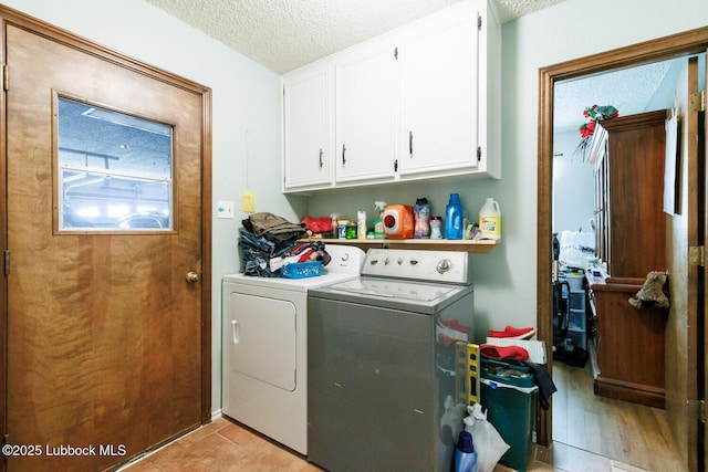 4610 63rd St, Lubbock, TX 79414 - laundry area featuring independent washer and dryer, cabinet space, and a textured ceiling