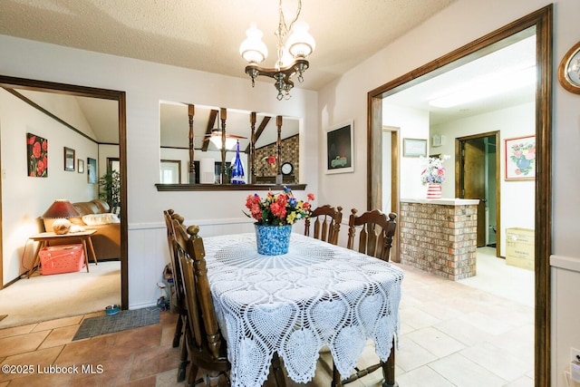 4610 63rd St, Lubbock, TX 79414 - carpeted dining area with a chandelier and tile patterned flooring